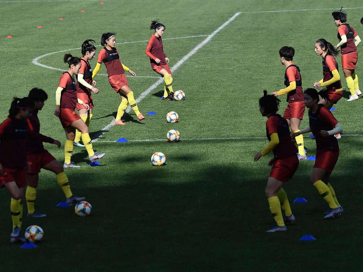 his photo taken on 20 May 2019 shows members of China`s women`s football team training in Beijing. Photo: AFP