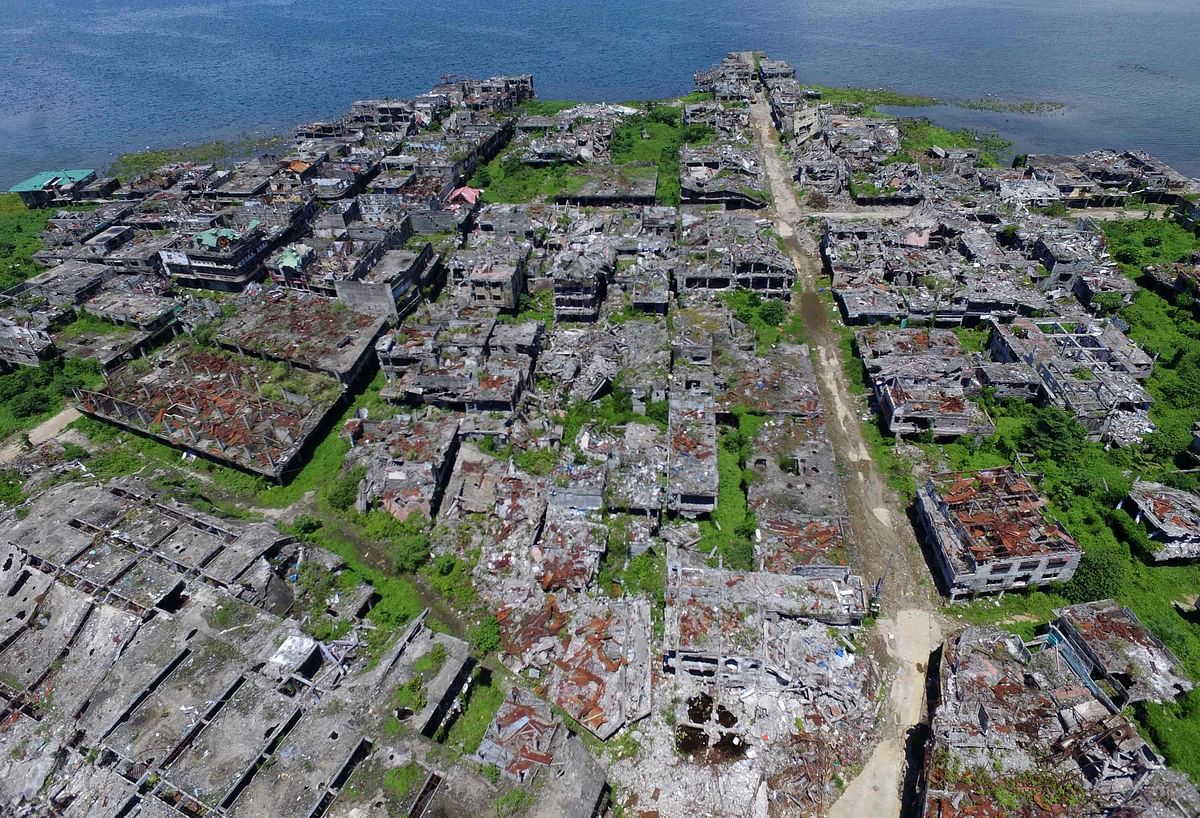 This aerial photo shows destroyed buildings in Marawi on the southern island of Mindanao 23 May, 2019. Two years after the Philippine city of Marawi was overrun by jihadists it remains in ruins, with experts warning that stalled reconstruction efforts are bolstering the appeal of extremist groups in the volatile region. Photo: AFP