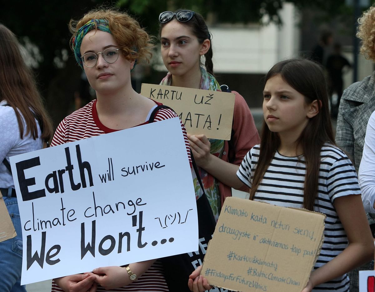 Students and climate activists with placards take part in the `Global Strike For Future` demonstration in in Vilnius, Lithuania, on 24 May, 2019, a global day of student protests aiming to spark world leaders into action on climate change. Photo: AFP