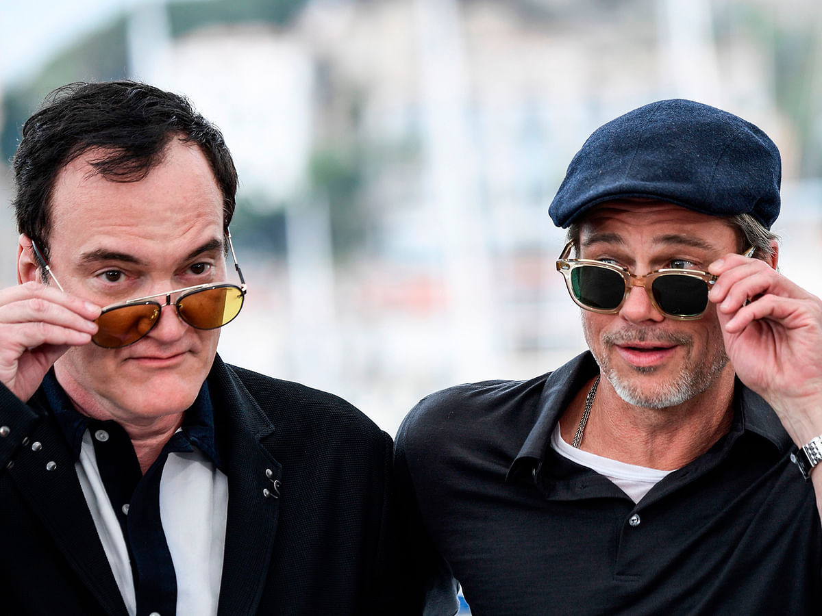 US film director Quentin Tarantino (L) and US actor Brad Pitt pose during a photocall for the film `Once Upon a Time... in Hollywood` at the 72nd edition of the Cannes Film Festival in Cannes, southern France, on 22 May. Photo: AFP