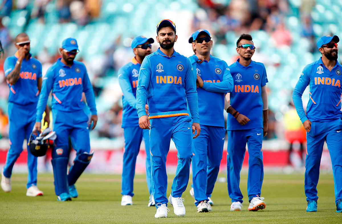 India`s Captain Virat Kohli (C) leads the team off the field of play after India are beaten by 6 wickets during the 2019 Cricket World Cup warm-up match between India and New Zealand at The Oval in London on 25 May 2019. Photo: AFP