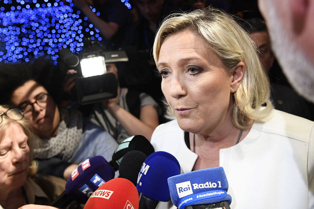 French far-right Rassemblement National (RN) president and member of Parliament Marine Le Pen speaks to the press after the announcement of initial results during an RN election-night event for European parliamentary elections on 26 May at La Palmeraie venue in Paris. Photo: AFP