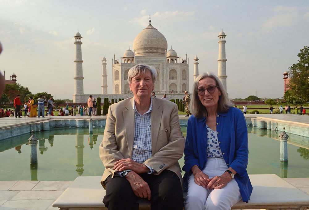 John Ira Bailey (L), president of the Academy of Motion Picture Arts and Sciences poses for a picture along with his wife as they visit the Taj Mahal in Agra on 27 May, 2019. Photo: AFP