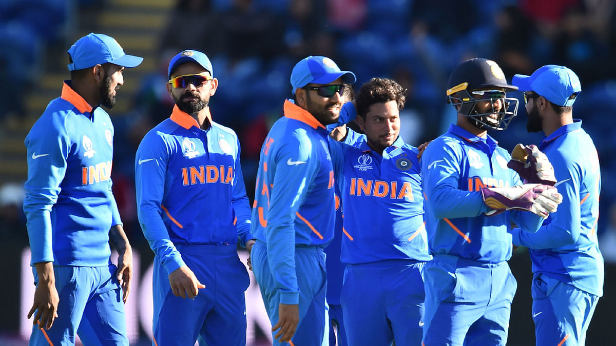 India`s Kuldeep Yadav (C) celebrates with teammates after taking the wicket of Bangladesh`s Mushfiqur Rahim for 90 during the 2019 Cricket World Cup warm up match between Bangladesh v India at Sophia Gardens stadium in Cardiff, south Wales, on 28 May 2019. AFP