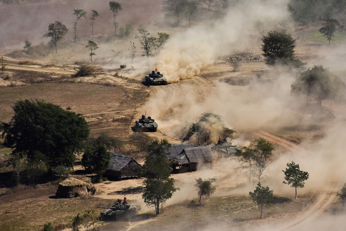 In this file photo taken on 21 January 2019 Myanmar military tanks manoeuvre in a field during combined exercise by Myanmar army and air force near Magway. Photo: AFP