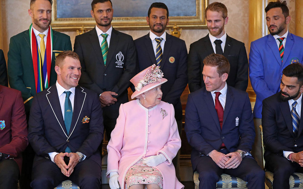 Britain`s Queen Elizabeth II (C) poses with the captains of the cricket teams participating in the ICC Cricket World Cup 2019, in the 1844 Room at Buckingham Palace, London on 29 2019, ahead of the competition`s Opening Party on the Mall. (L-R) Back row: South Africa`s captain Faf du Plessis, Bangladesh`s captain Mashrafe Mortaza, Sri Lanka`s captain Dimuth Karunaratne, New Zealand`s captain Kane Williamson, Afghanistan`s captain Gulbadin Naib. Front row: Australia`s captain Aaron Finch Britain`s Queen Elizabeth II, England`s captain Eoin Morgan, India`s captain Virat Kohli. Photo: AFP