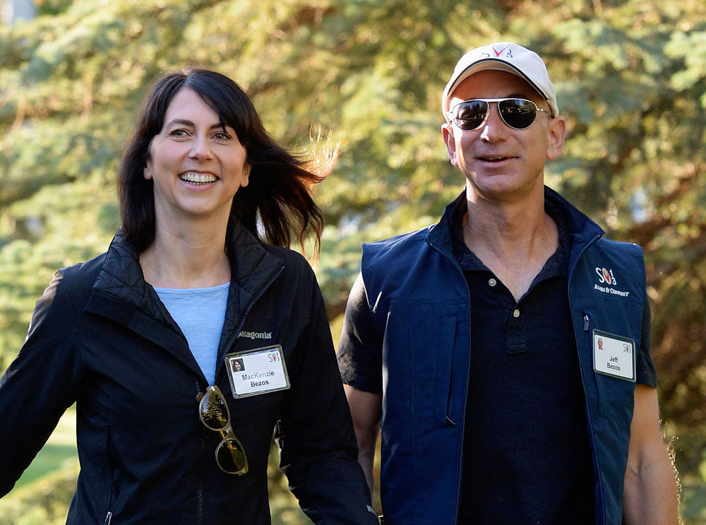 In this file photo taken on 12 July 2013, Mackenzie Bezos (L) and her husband Jeff Bezos, founder and CEO Amazon.com, arrive for the Allen & Co., arrives to the Allen & Co. annual conference in Sun Valley, Idaho, US. Photo: AFP