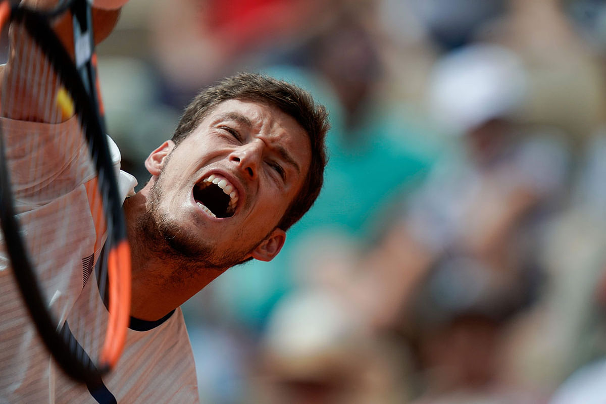 Spain`s Pablo Carreno Busta serves the ball to France`s Benoit Paire during their men`s singles third round match on day six of The Roland Garros 2019 French Open tennis tournament in Paris on 31 May, 2019. Photo: AFP