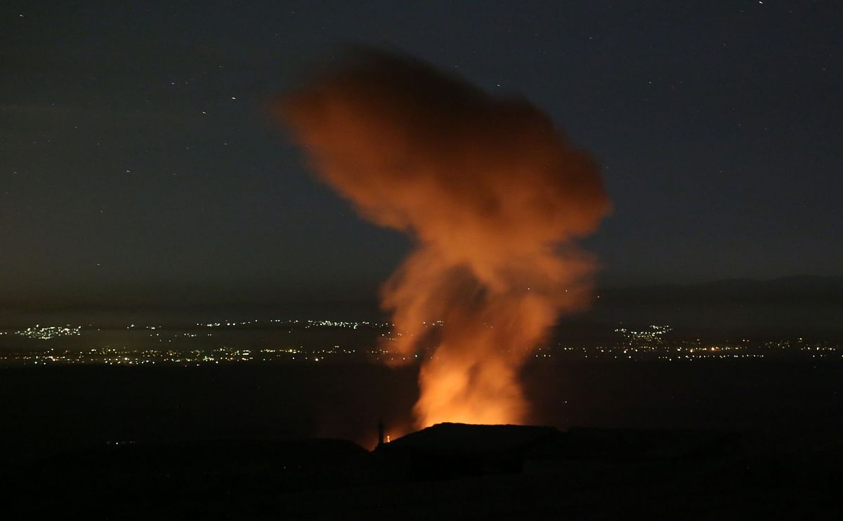 A fire rages and smoke billows following reported Syrian government forces` bombardment on the town of Khan Sheikhun in the southern countryside of Syria`s Idlib province overnight on 2 June, 2019. A spike in violence in and around a jihadist bastion in northwest Syria has killed 948 people in a month, almost a third of them civilians, a war monitor said this week. Photo: AFP