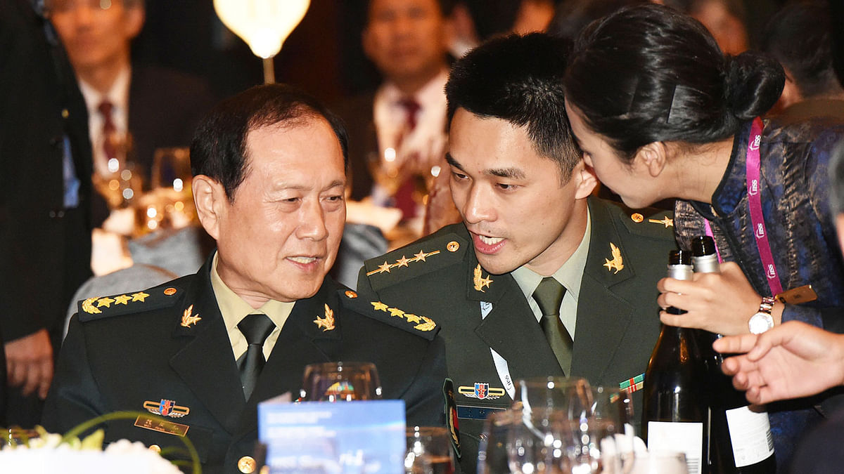 China`s defence minister Wei Fenghe (L) attends the opening of the IISS Shangri-La Dialogue summit in Singapore on 31 May 2019. Photo: AFP