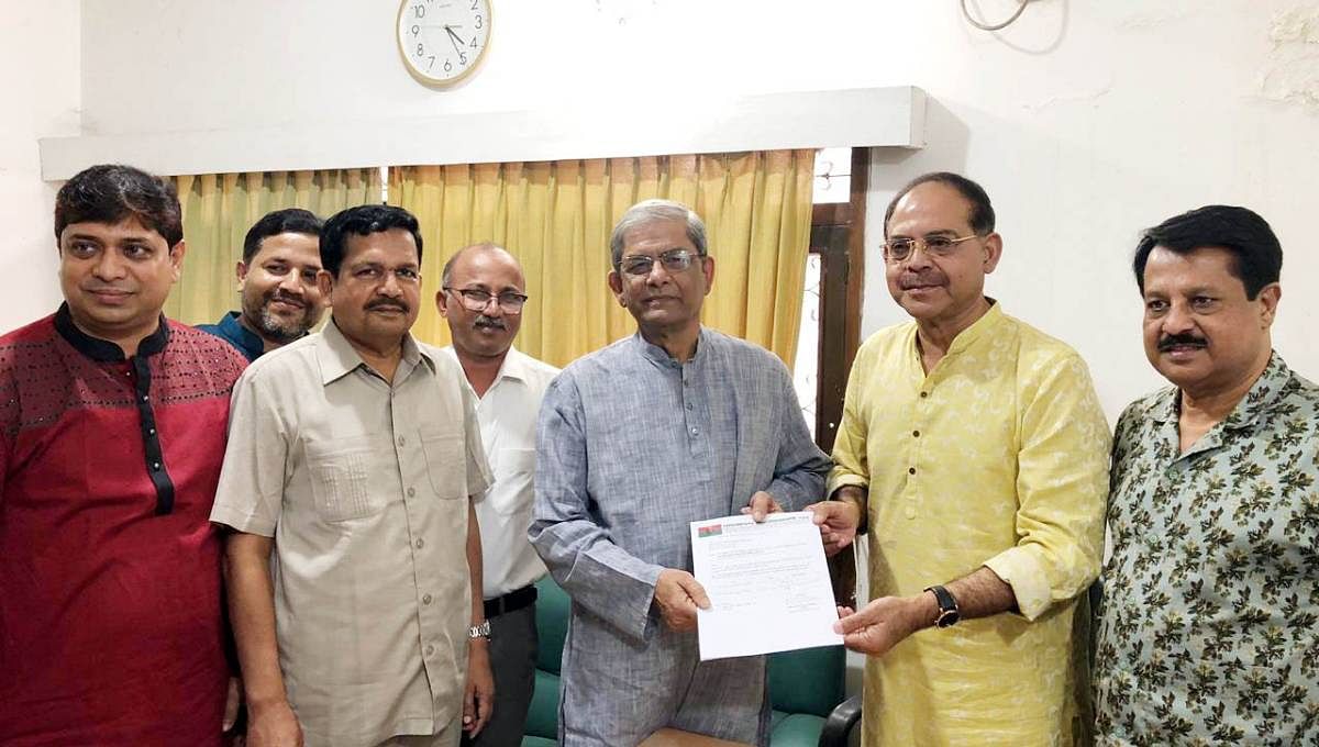 BNP secretary general Mirza Fakhrul Islam Alamgir hands over party letter to GM Siraj nominating him as a candidate for Bogura-6 by-polls. Photo: UNB