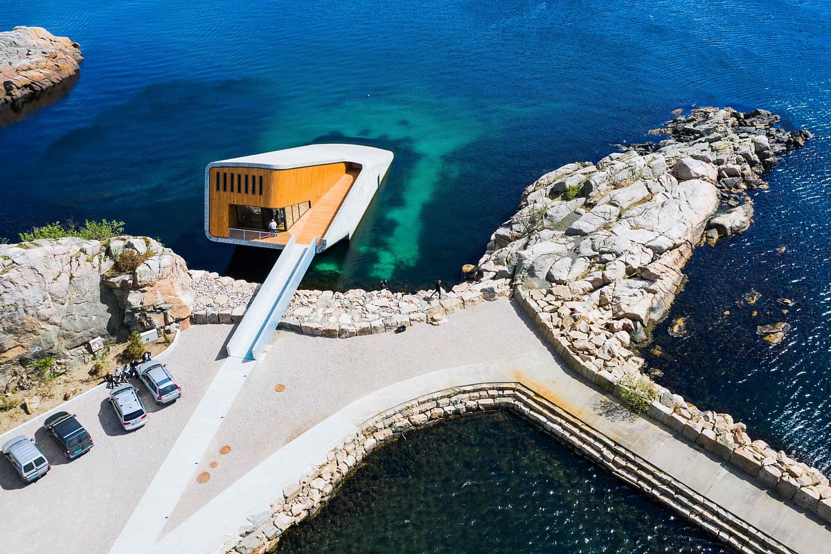 This file photo taken on 2 May 2019 shows an aerial view of Under, a restaurant that is semi-submerged beneath the waters of the North Sea in Lindesnes near Kristiansand, some 400 km south west of Oslo. Photo: AFP