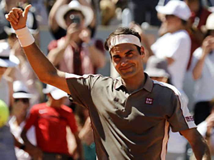Switzerland`s Roger Federer celebrates after winning against Argentina`s Leonardo Mayer during their men`s singles fourth round match on day eight of The Roland Garros 2019 French Open tennis tournament in Paris on 2 June 2019. Photo: AFP