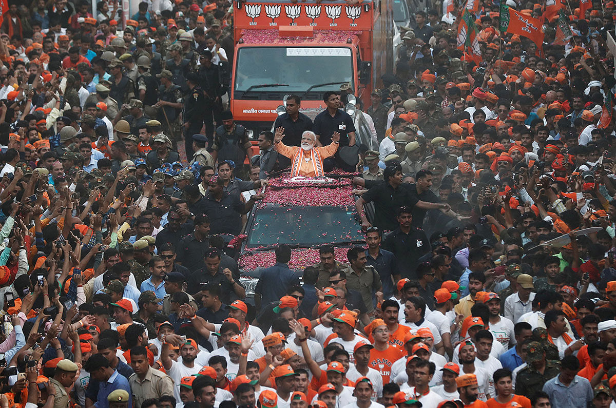India`s prime minister Narendra Modi waves towards his supporters during a roadshow in Varanasi, India on 25 April. Photo: Reuters