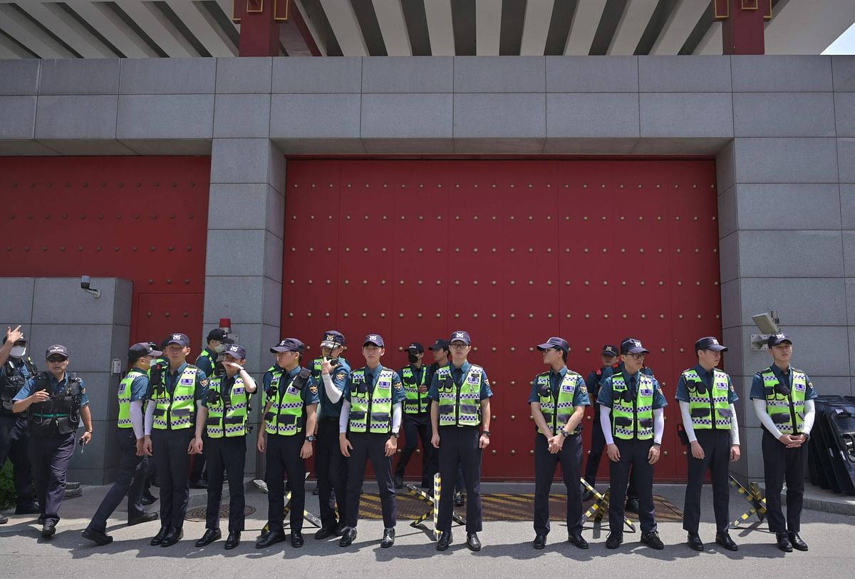Police stand guard in front of the Chinese embassy in Seoul on 4 June 2019 as South Korean protestors hold a rally to mark the 30th anniversary of crackdown on Tiananmen Square. Photo: AFP