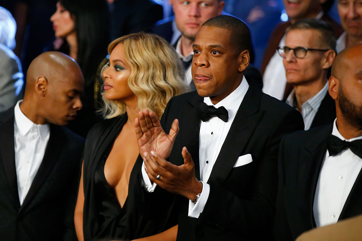 In this file photo taken on 21 November 2015 Beyonce Knowles and Jay-Z look on before Miguel Cotto takes on Canelo Alvarez in their middleweight fight at the Mandalay Bay Events Center in Las Vegas, Nevada. Photo: AFP