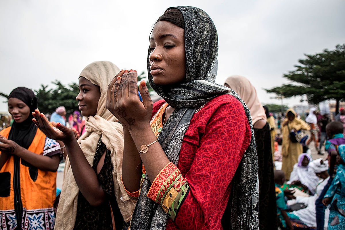 Muslim worshippers are seen praying during a mass prayer to celebrate Eid al-Fitr on 4 June, 2019 at the Stade des Martyrs in Kinshasa. Muslims worldwide celebrate the Eid al-Fitr holidays, which mark the end of the holy fasting month of Ramadan. Photo: AFP