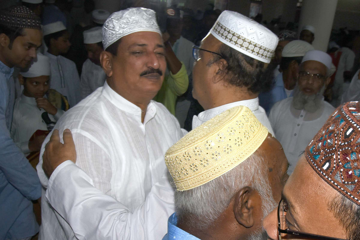 Former mayor of Rajshahi City Corporation Mizanur Rahman Minu and current mayor AHM Khairuzzaman Liton embrace after offering Eid-ul-Fitr prayers at Hazrat Shah Makhdum Darga Mosque in Rajshahi on Wednesday, 5 June. Photo: Shahidul Islam.
