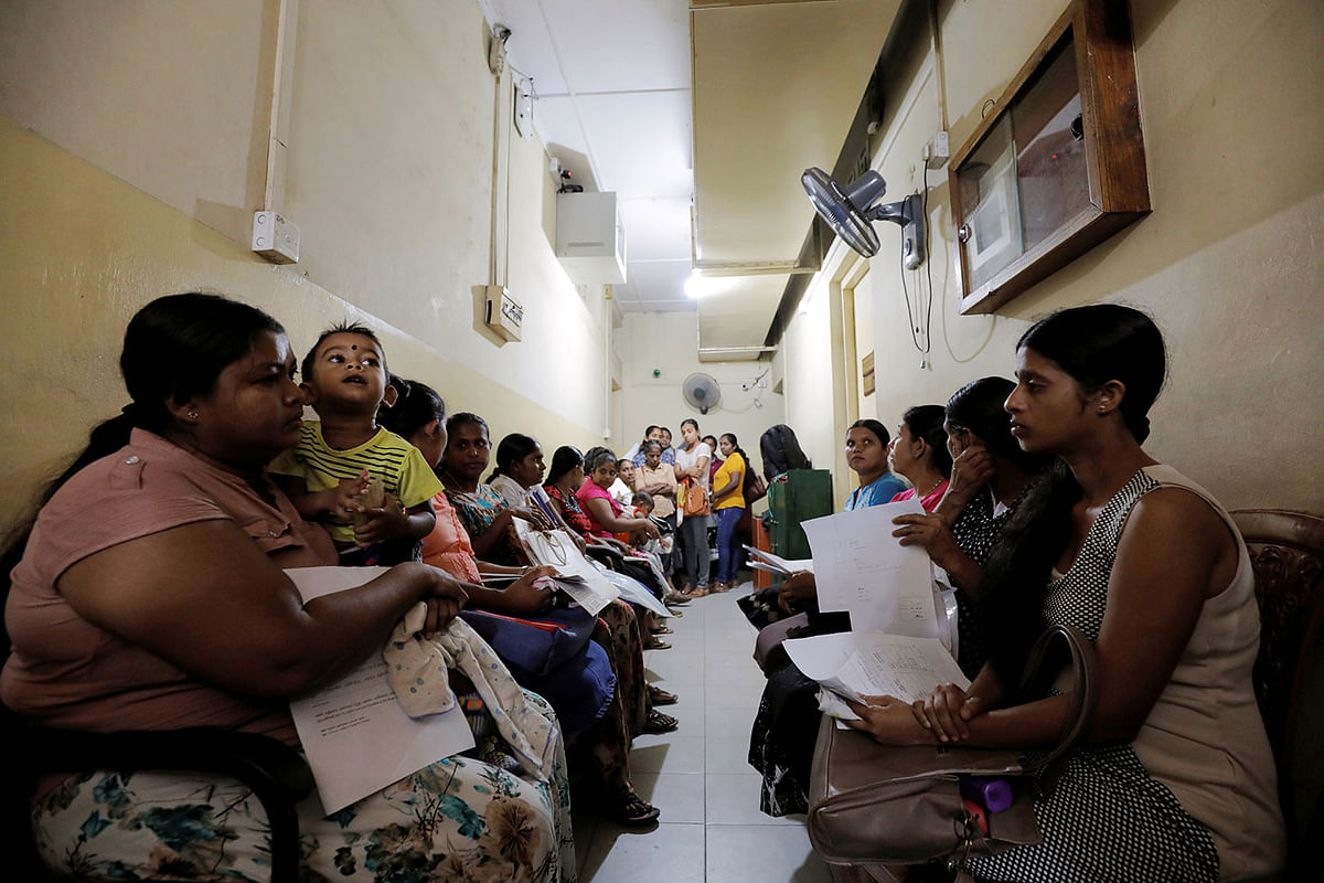 Women wait to make statements and complains against Muslim doctor Segu Shihabdeen Mohamed Shafi, who was arrested after accusations of secretly sterilising Buddhist women during their caesarean deliveries at a hospital in Kurunegala. Photo: Reuters