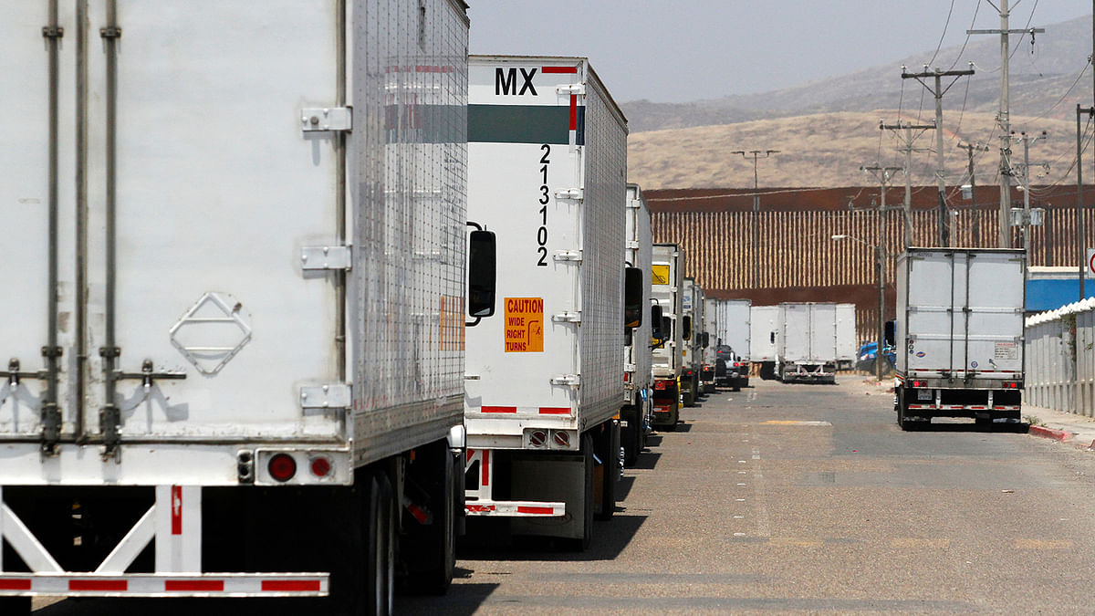 Trucks wait in queue for border customs control, to cross into the US, at the Otay border crossing in Tijuana, Mexico on 7 June. Photo: Reuters