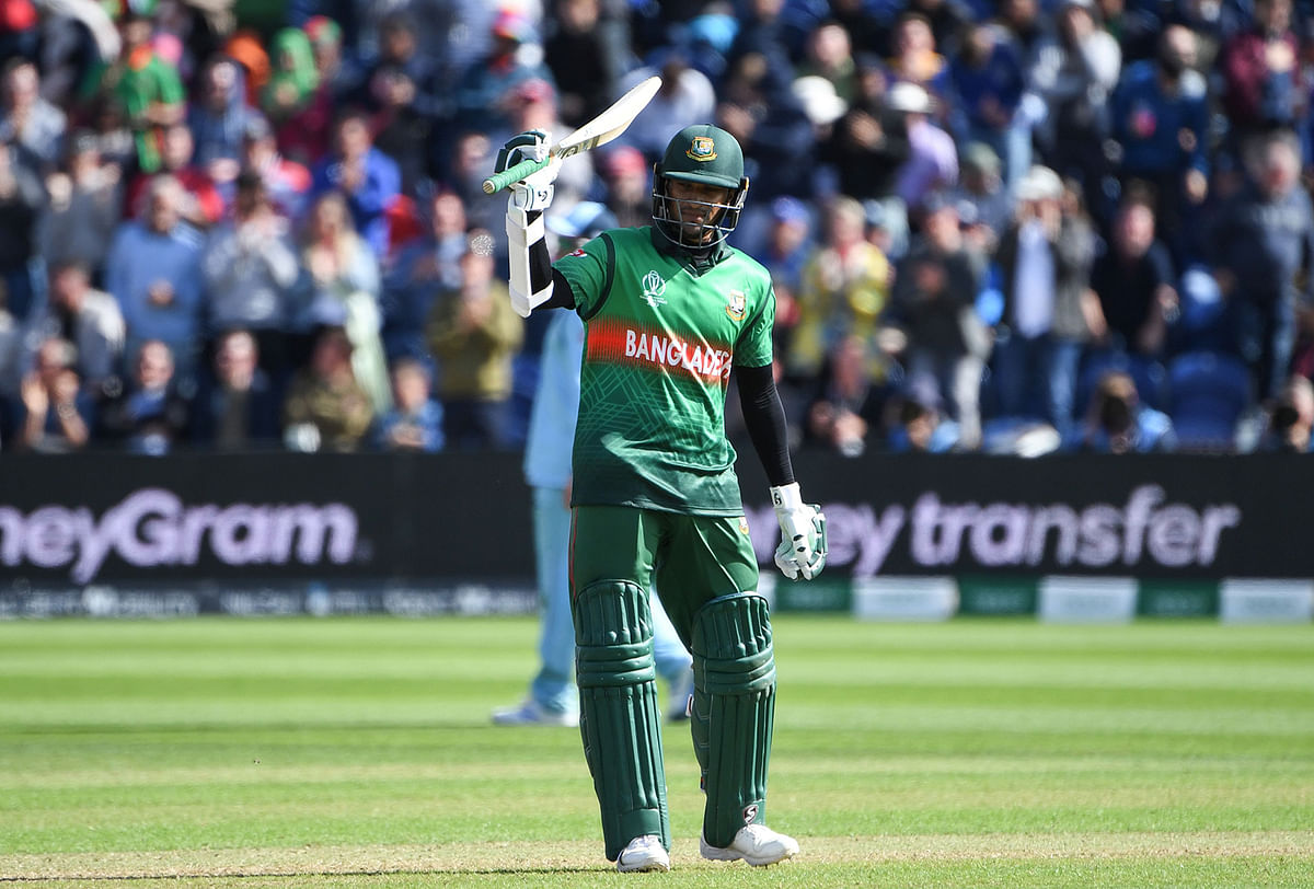Bangladesh`s Shakib Al Hasan celebrates after scoring a century (100 runs) during the 2019 Cricket World Cup group stage match between England and Bangladesh in Cardiff, south Wales, on 8 June, 2019. Photo: AFP