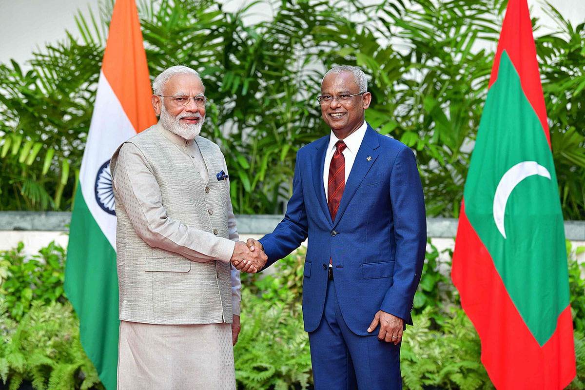In this picture taken on 8 June 2019, Indian prime minister Narendra Modi (L) shake hands with president of Maldives Ibrahim Mohamed Solih during his one-day visit to Maldives in Male. Photo: AFP