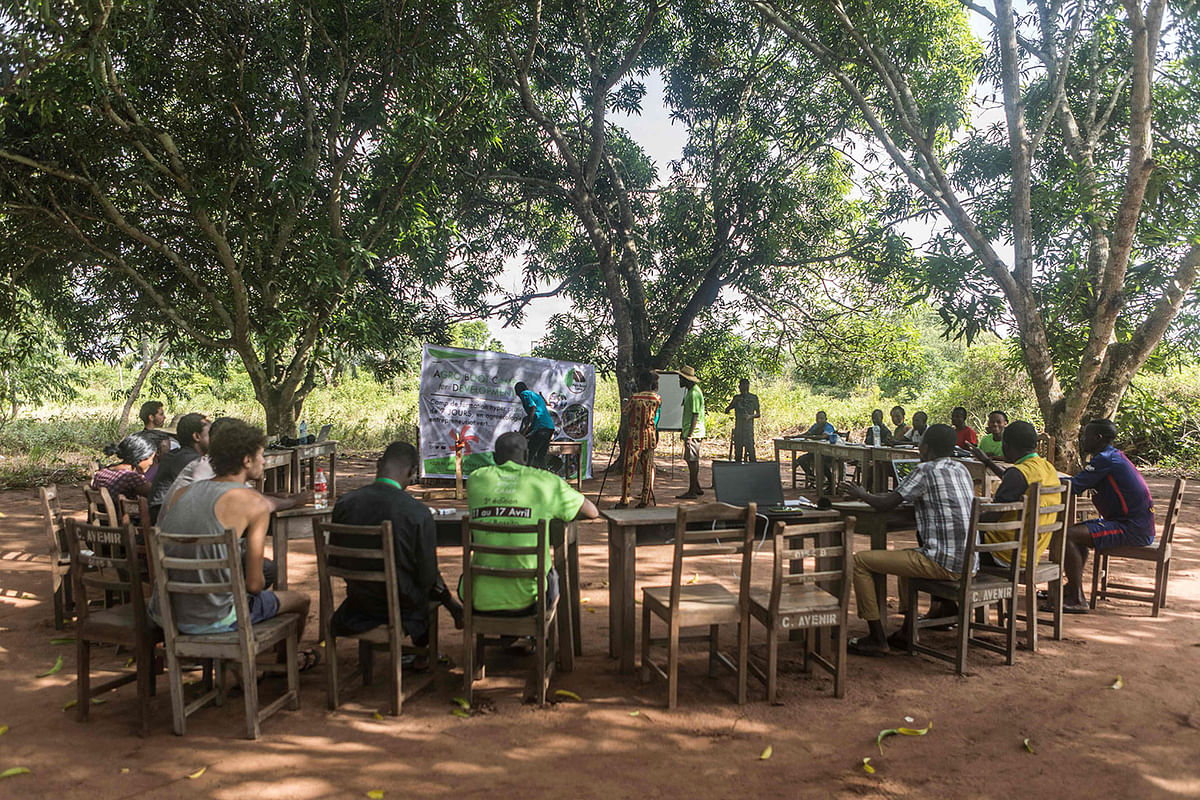 Participants to an `agro-bootcamp`, aimed at preparing young people for a future sustainably working the land, follow a training on site, on 16 April 2019, in Tori-Bossito, just outside Benin`s economic capital Cotonou. Photo: AFP