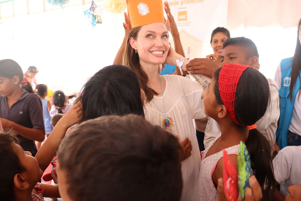 Refugee Agency`s special envoy Angelina Jolie plays with children in a camp run by the UN Refugee Agency, UNHCR, in Maicao, Colombia on 8 June 2019. Photo: Reuters