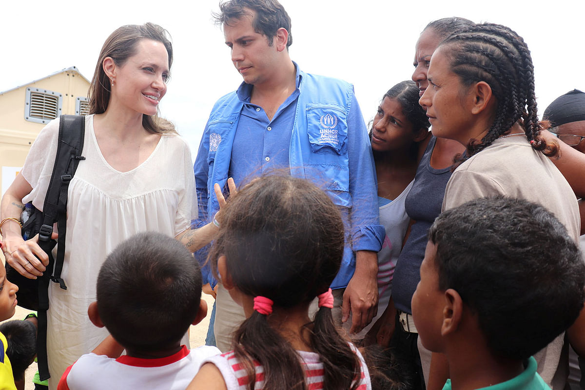 Refugee Agency`s special envoy Angelina Jolie talks to people inside a camp run by the UN Refugee Agency, UNHCR, in Maicao, Colombia on 8 June 2019. Photo: Reuters
