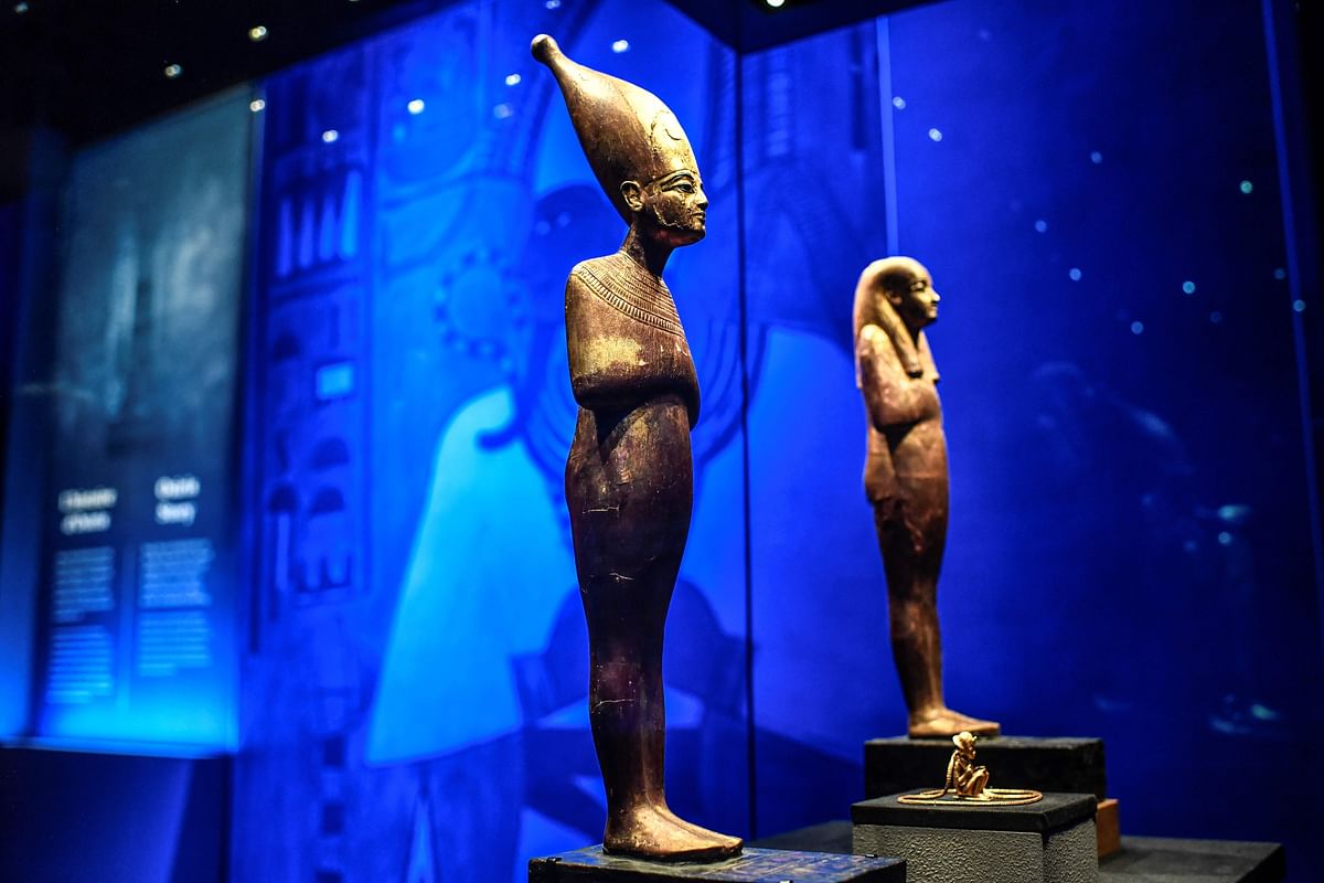 In this file photograph taken on 21 March 2019, statuettes are displayed during the exhibition `Tutankhamun,Treasures of the Golden Pharaoh` at La Villette in Paris. Photo: AFP