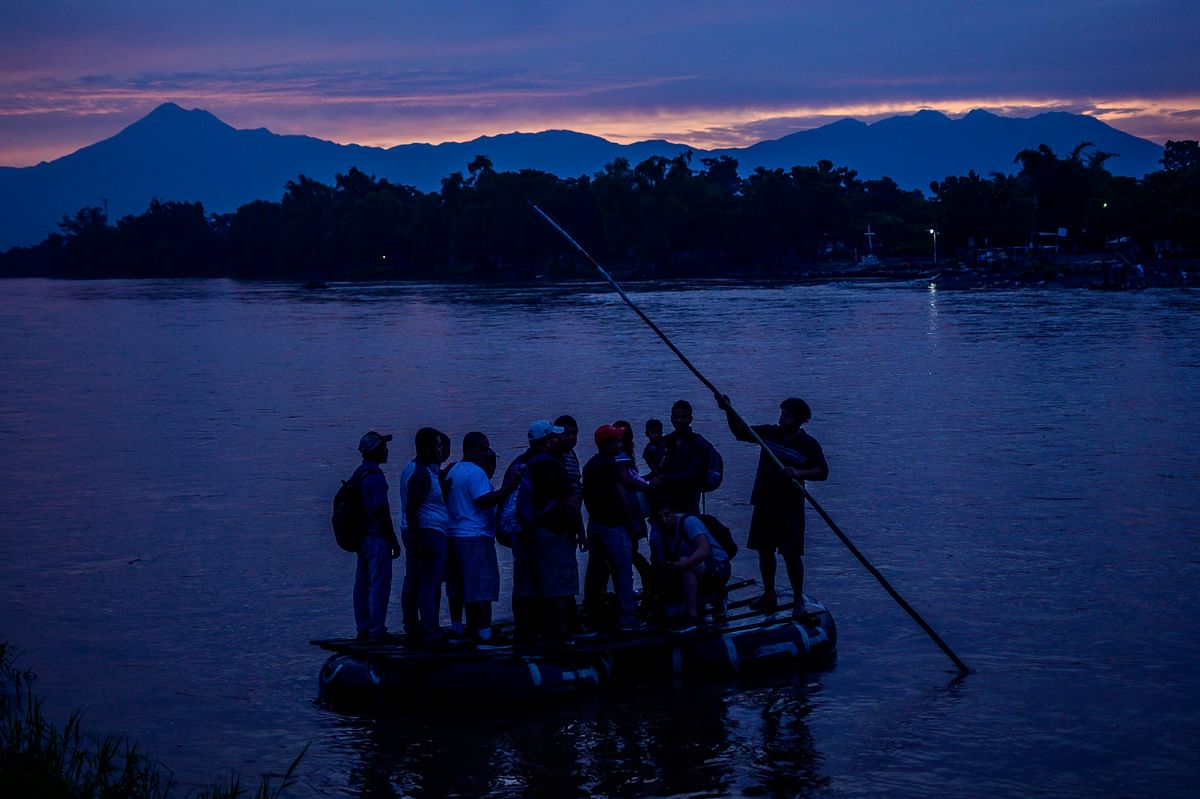 Central American migrants and locals arrive in Ciudad Hidalgo in Chiapas State, Mexico, after illegally crossing the Suchiate river from Tecun Uman in Guatemala in a makeshift raft, on 10 June 2019. Photo: AFP