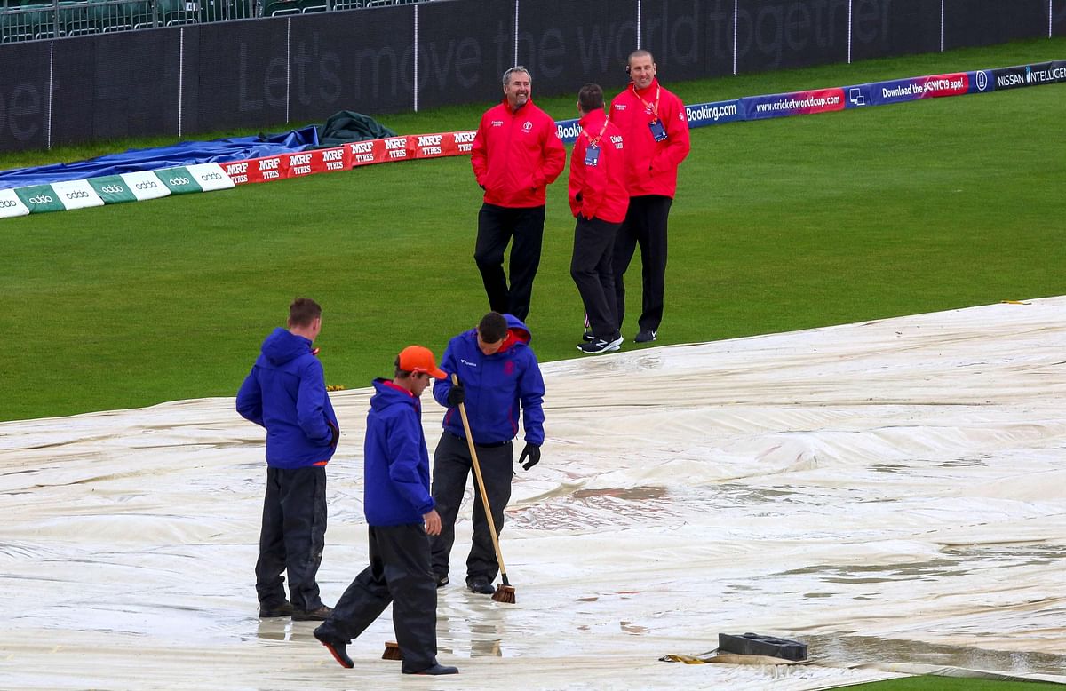 Umpires Richard Kettleborough, Richard Illingworth and Michael Gough inspect the pitch after rain delayed the start of the 2019 Cricket World Cup group stage match between Bangladesh and Sri Lanka at Bristol County Ground in Bristol, southwest England, on 11 June 2019. Photo: AFP