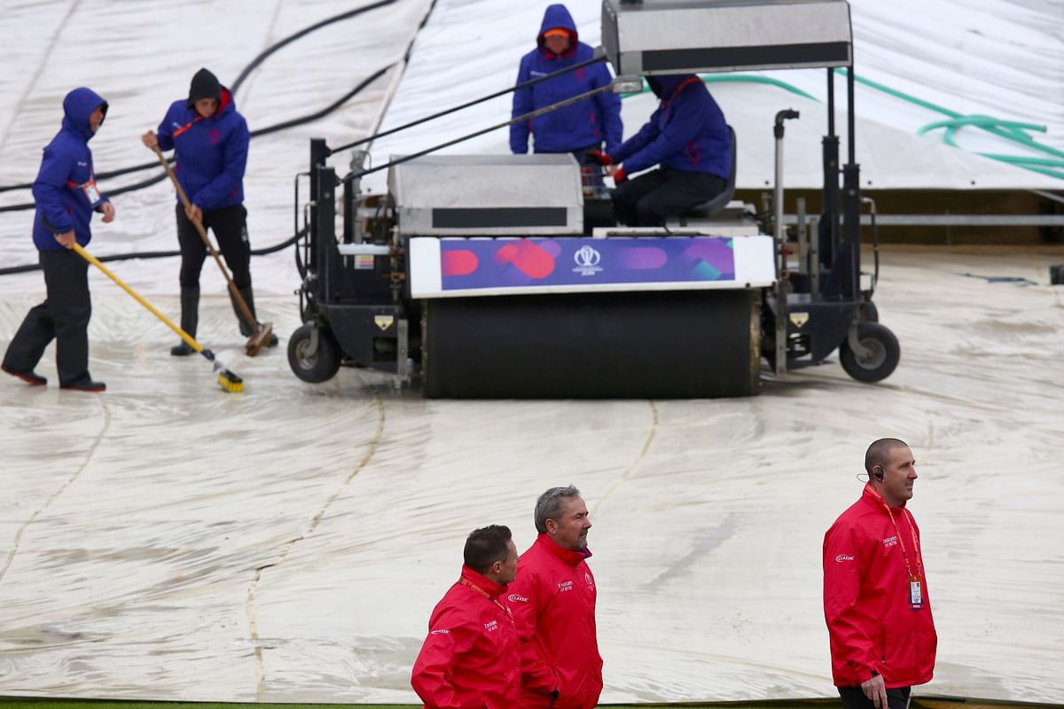 Umpires Richard Kettleborough, Richard Illingworth and Michael Gough inspect the pitch after rain delayed the start of the 2019 Cricket World Cup group stage match between Bangladesh and Sri Lanka at Bristol County Ground in Bristol, southwest England, on June 11, 2019. AFP