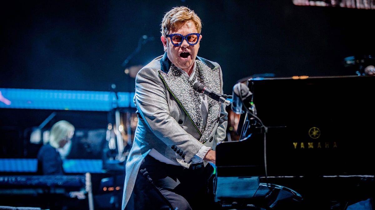 English singer-songwriter Elton John performs on stage during the `Farewell Yellow Brick Road`-Tour in the Ziggo Dome in Amsterdam on 8 June. Photo: AFP