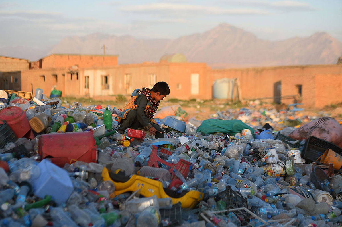 In this photograph taken on 10 June an Afghan child works in a plastic recycle factory on the outskirts of Mazar-i-Sharif. AFP File Photo