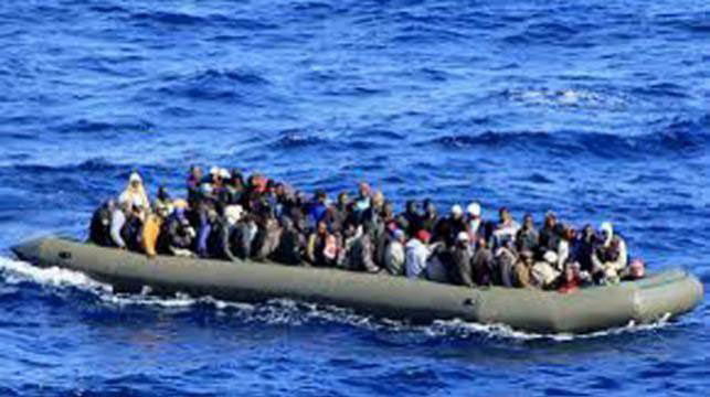 Migrants stranded in a boat. File Photo