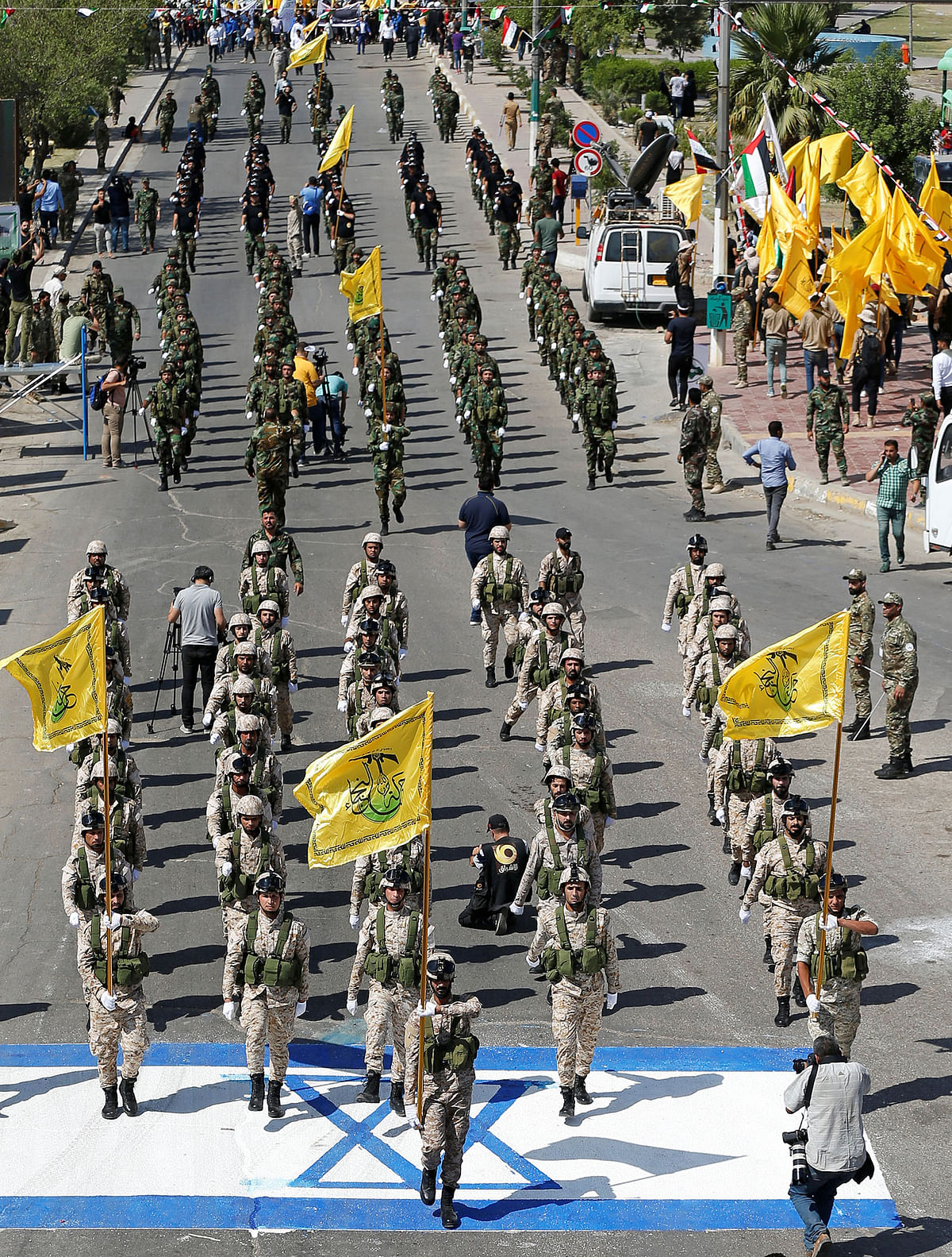 Iraqi Shi`ite Muslims march during a parade marking the annual al-Quds Day (Jerusalem Day) on the last Friday of the Muslim holy month of Ramadan in Baghdad. Photo: Reuters