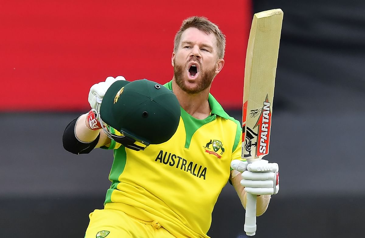Australia`s David Warner celebrates after scoring a century (100 runs) during the 2019 Cricket World Cup group stage match between Australia and Pakistan at The County Ground in Taunton, southwest England, on 12 June 2019. Photo: AFP