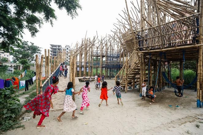 Street children play at a toy house built by students of BUET and Brac University. Leedo Peace Home, a non-profit organization working for street children, proposed this environment friendly toy house made of bamboo. Basila, Mohammadpur. 14 June, 2019. Photo: Dipu Malakar