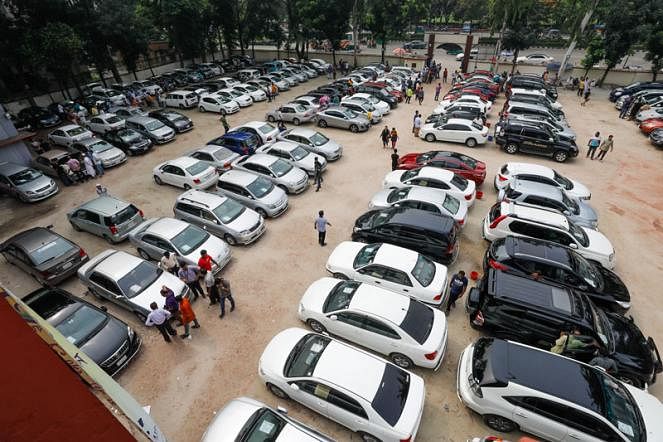 Used cars are at display at a fair in Rajdhani High School in Manik Mia Avenue. Customers can buy second hand cars from the fair organized on every Friday. 14 June, 2019. Photo: Dipu Malakar.