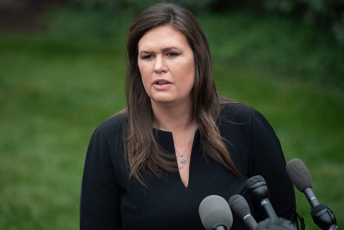 In this file photo taken on 8 May White House press secretary Sarah Sanders speaks to the press in the driveway of the White House in Washington, DC. Photo: AFP
