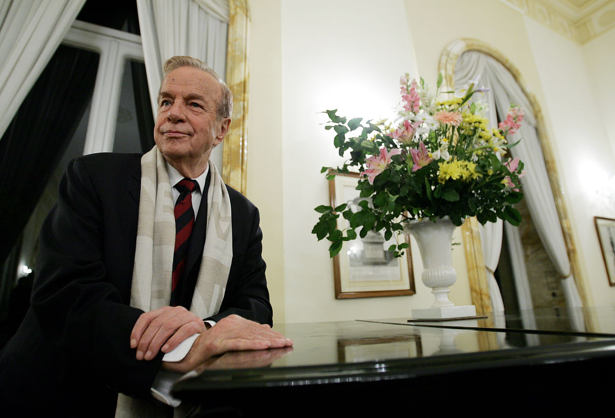 In this file photo taken on 24 November, 2004 Italian film director Franco Zeffirelli poses at the British Embassy in Rome before receiving the medal of knighthood from the British ambassador to Italy. Photo: AFP