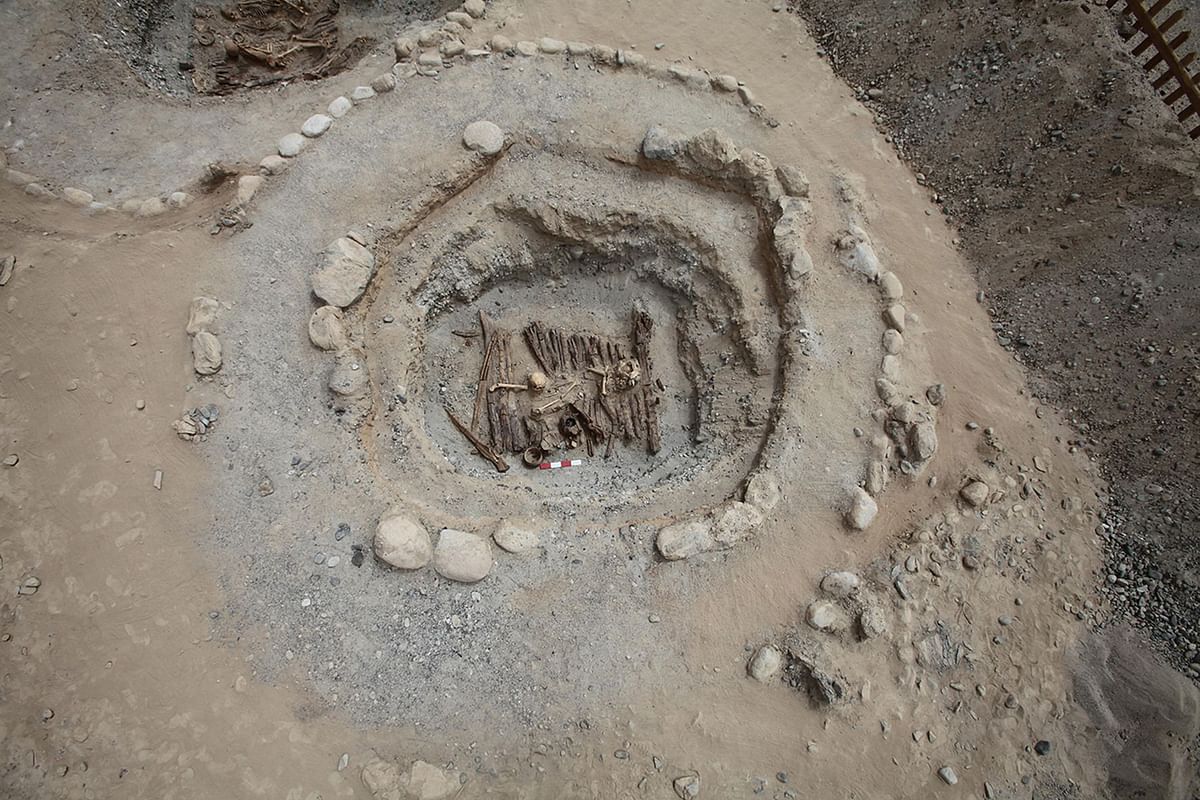 In this photo recieved by AFP on 11 June 2019 from the Institute of Archaeology, Chinese Academy of Social Sciences, an excavated tomb, located northeast of Qushiman Village in the Tashkurgan Tajik Autonomous County of Xinjiang province, is displayed. At a burial site high in the Pamir Mountains, music from an ancient harp and the smell of burning cannabis and juniper incense fill the air, part of an elaborate ceremony to commune with the divine -- or the deceased.