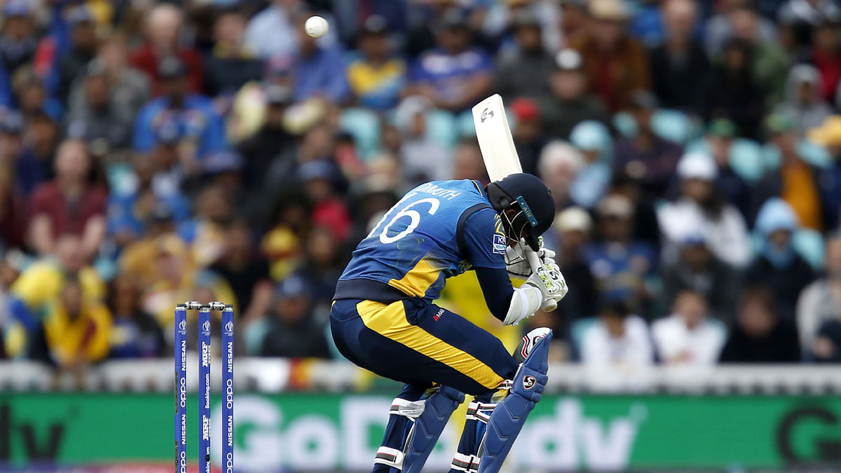 Sri Lanka`s captain Dimuth Karunaratne leaves the crease after losing his wicket for 97 during the 2019 Cricket World Cup group stage match between Sri Lanka and Australia at The Oval in London on 15 June 2019. Photo: AFP