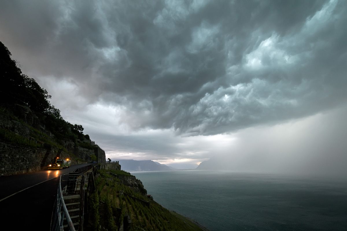 This picture taken on 15 June 2019 shows storm clouds covering the Lake Geneva, above Chexbres, western Switzerland. Photo: AFP