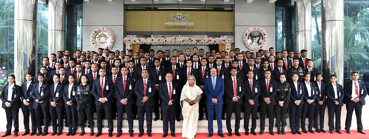 Prime minister Sheikh Hasina takes part in a photo session with the members of Special Security Force (SSF) at its Officers’ Mess in Tejgaon, Dhaka marking the 33rd founding anniversary of the force on 15 June. Photo: PID