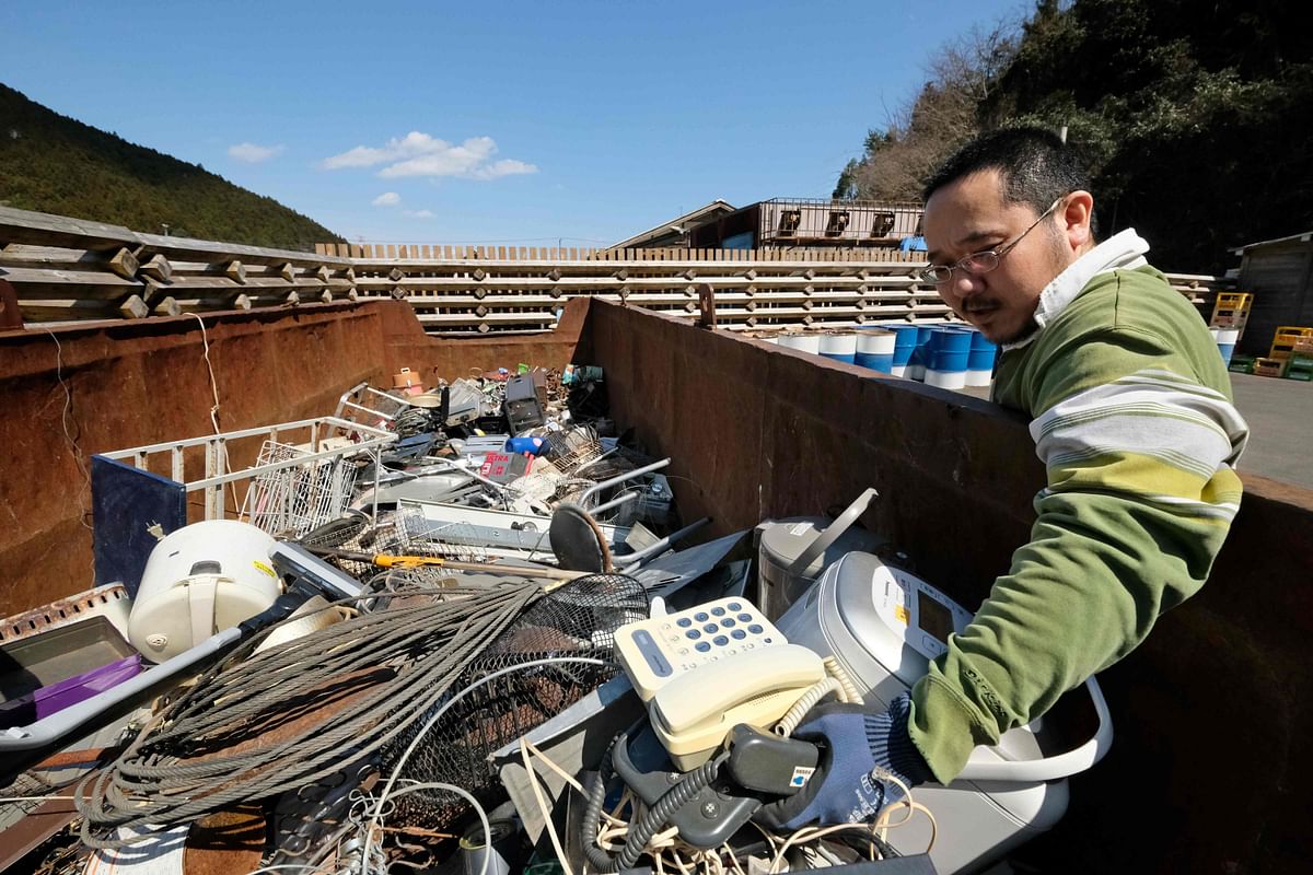 This picture taken on 14 March 2019 shows a resident bringing disused household goods at a waste centre in the town of Kamikatsu, Tokushima prefecture. Photo: AFP