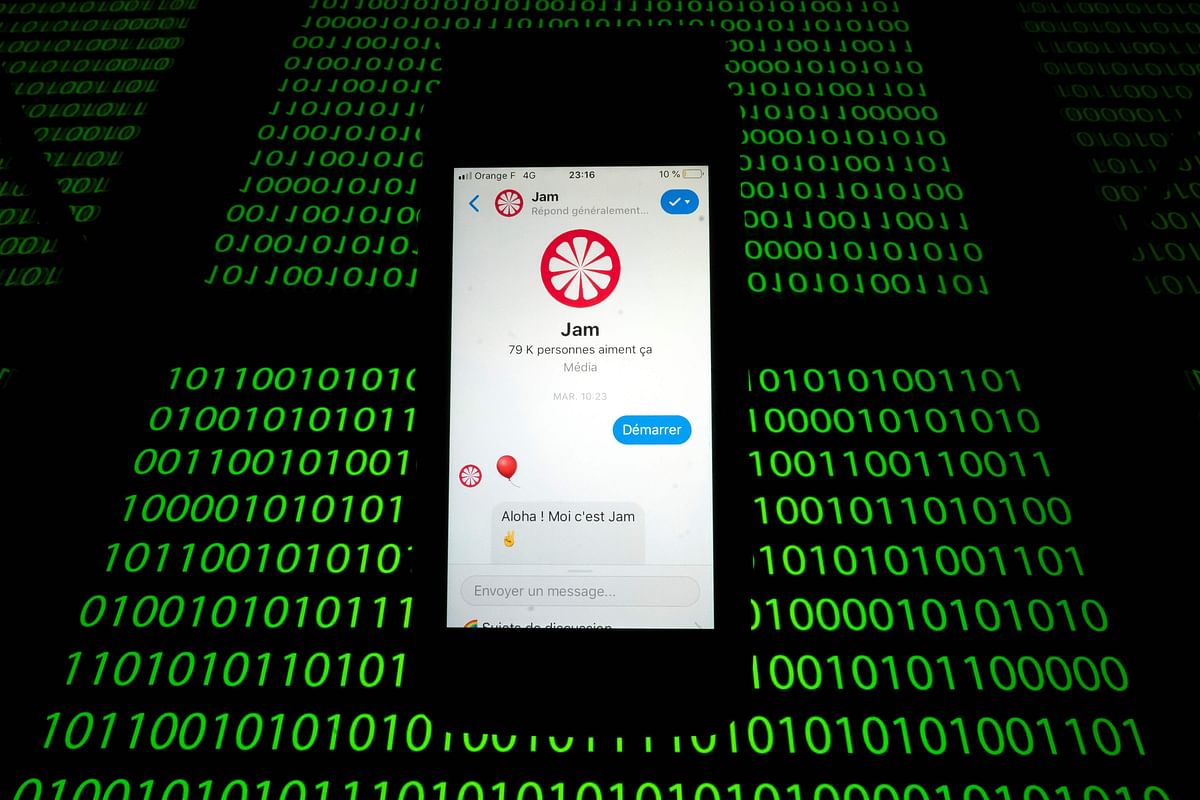 This file photo taken on 28 February 2019 shows the `Jam` chat bot displayed on a smartphone and a binary code displayed by a tablet in Paris. Some traditional news media as well as start-ups rely on `chatbots`, computer programs that provide knowledge online based on a fun conversation with a connected audience. The `Jam` chat bot for example is a robot which tells stories to enrich the news and to strengthen general knowledge. Photo: AFP