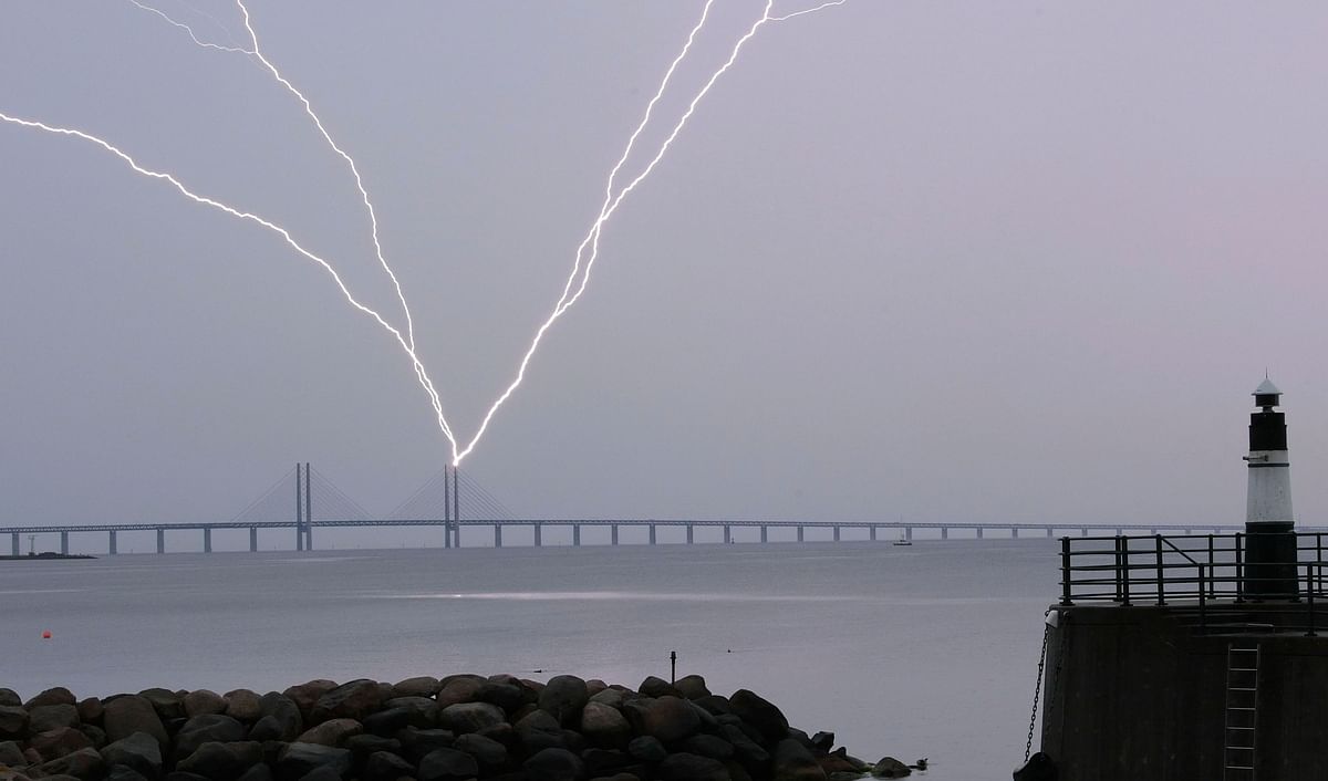 Lightning strikes the Oresund Bridge between Sweden and Denmark, during a thunder storm, seen from Malmo, Sweden, on 15 June 2019. Photo: AFP