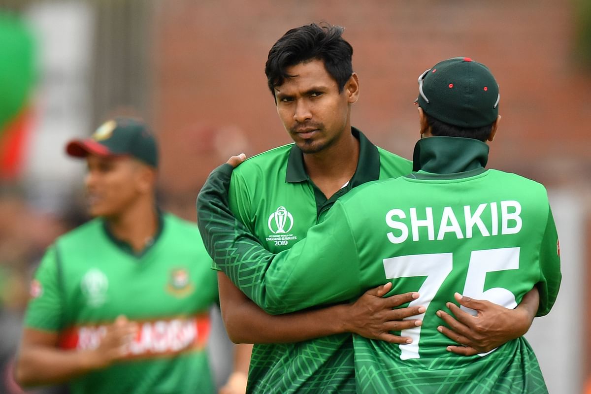 Bangladesh`s Mustafizur Rahman (L) celebrates with Bangladesh`s Shakib Al Hasan (R) after taking the wicket of West Indies` Andre Russell during the 2019 Cricket World Cup group stage match between West Indies and Bangladesh at The County Ground in Taunton, southwest England, on 17 June 2019.